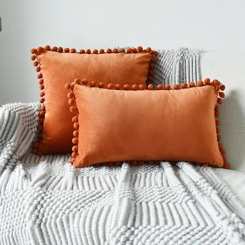 Soft velvet throw pillow cover by MC THE BLACK DIAMOND, large solid beige cushion with pom pom accents for cozy sofa decor