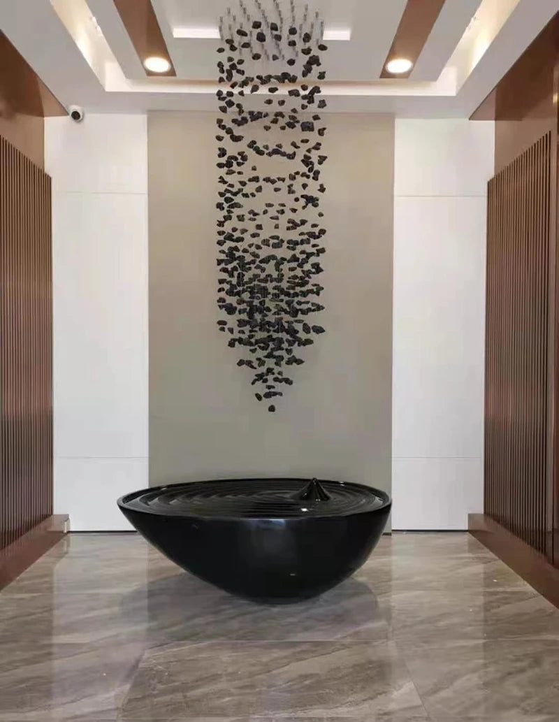 Large modern stone crystal LED chandelier by MC THE BLACK DIAMOND, featuring luxury staircase and living room lighting.
