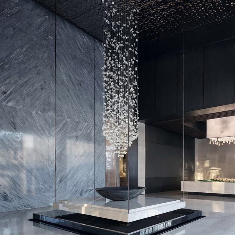 Large modern stone crystal LED chandelier by MC THE BLACK DIAMOND, featuring luxurious design for staircase and living room lighting.