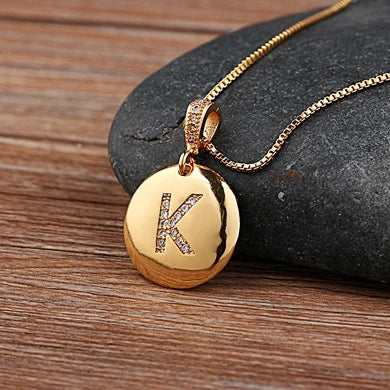 Gold initial letter necklace featuring the letter A with cubic zirconia accents, crafted by 𝕄𝕔 𝕋𝕙𝕖 𝔹𝕝𝕒𝕔𝕜 𝔻𝕚𝕒�