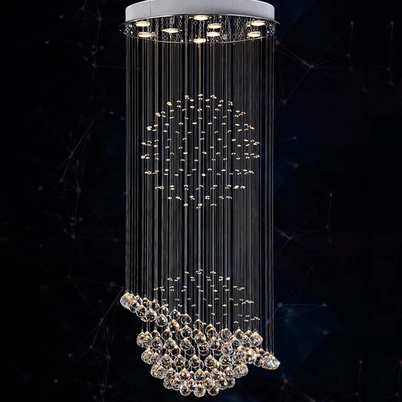 LED crystal chandelier by MC THE BLACK DIAMOND featuring hanging crystal accents in a modern living room setting