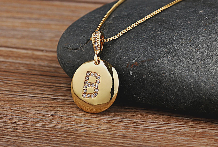 Nidin initial letter necklace for women and girls, copper pendant with CZ gemstone charm, personalized jewelry from 𝕄𝕔 𝕋𝕙𝕖 𝔹𝕝𝕒𝕔𝕜 𝔻𝕚