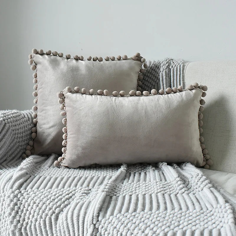 Soft velvet throw pillow cover by MC THE BLACK DIAMOND featuring large size, solid color, and cozy pom-pom details for sofa decor.