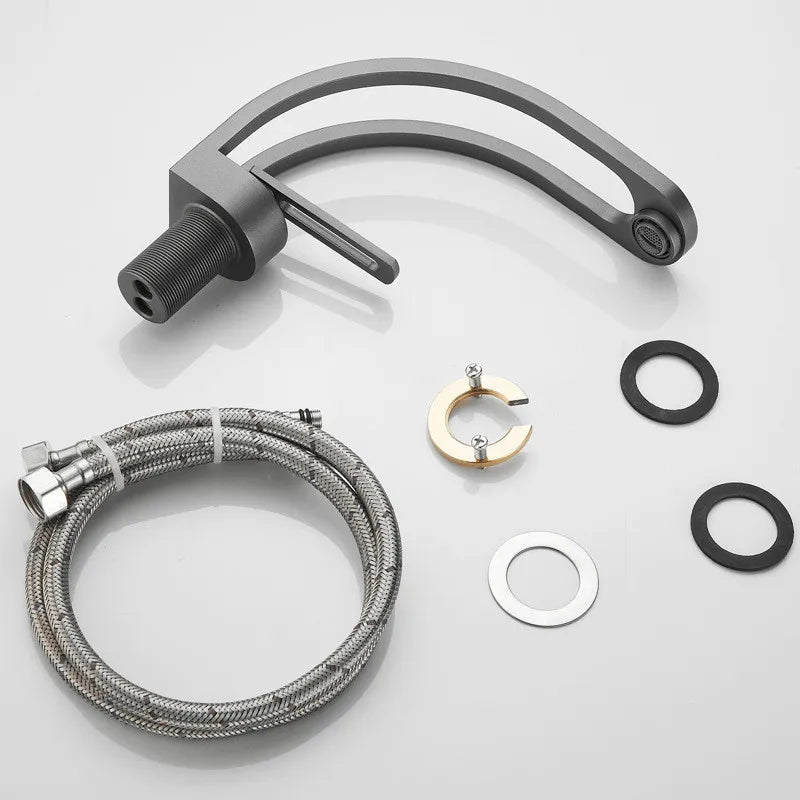 Black, grey, white, and gold bathroom mixer tap for wash basin by MC THE BLACK DIAMOND, featuring a sleek modern design.