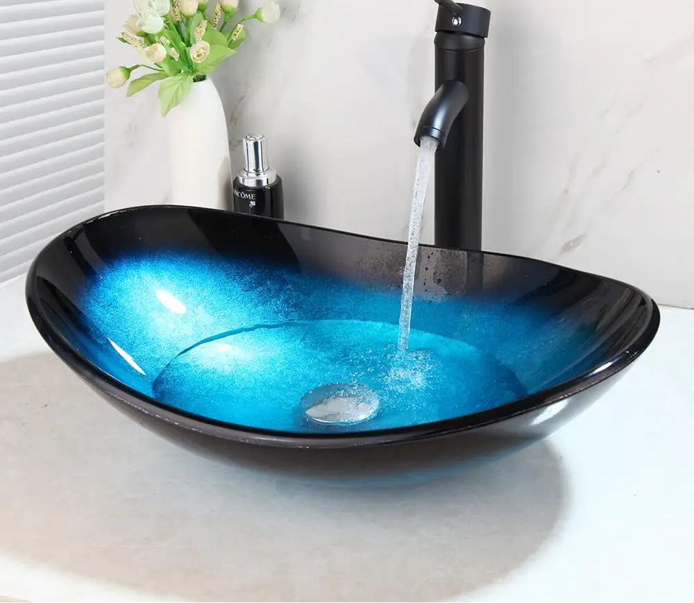 MC THE BLACK DIAMOND ZAPPO tempered glass bathroom vessel sink with waterfall black faucet and oval blue basin, above counter design