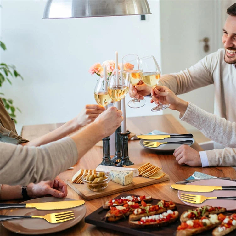 Stainless steel LMETJMA 24-piece flatware set with knives, forks, and spoons from Mc The Black Diamonds for dining and kitchen use.
