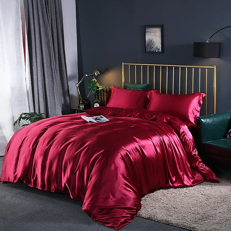 Black satin duvet cover from Mc The Black Diamonds, showcasing a smooth, solid color bedding set with a quilted design.