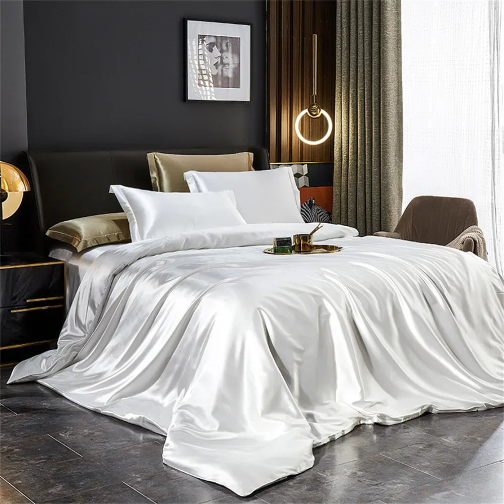 Luxurious solid silk bedding set by MC THE BLACK DIAMOND, includes duvet cover, bed sheet, and pillowcases in various sizes.