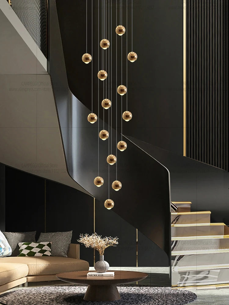 Modern MC THE BLACK DIAMOND LED staircase pendant light hanging in a living room with sleek design and warm illumination.