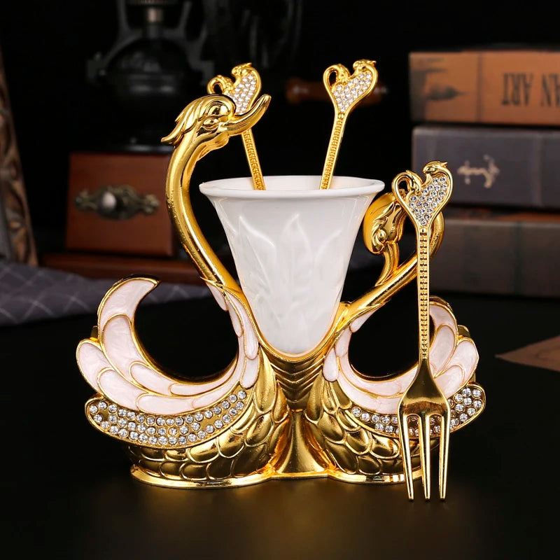 Swan-shaped fruit fork and spoon set by ๐๐ ๐๐๐ ๐น๐๐๐๐ ๐ป๐๐๐๐ ๏ฟฝ