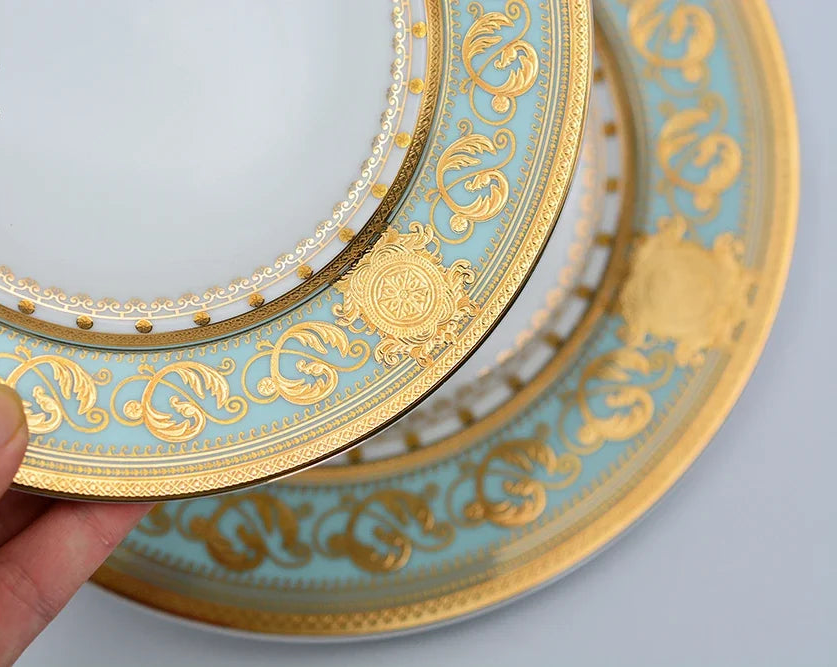 Gold embossed porcelain dinnerware set by MC THE BLACK DIAMOND featuring luxury bone china with intricate patterns.