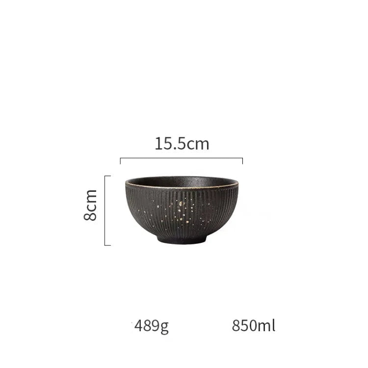 Luxury Golden Black dinnerware set by MC THE BLACK DIAMOND featuring elegant plates and bowls with gold accents.