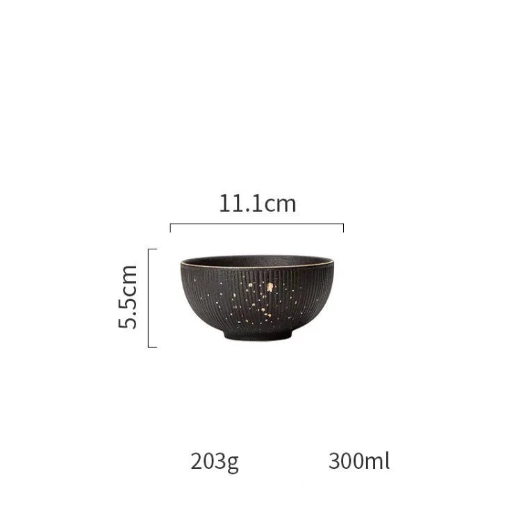 Luxury golden and black dinnerware set by MC THE BLACK DIAMOND, featuring elegant plates and bowls for sophisticated table settings.