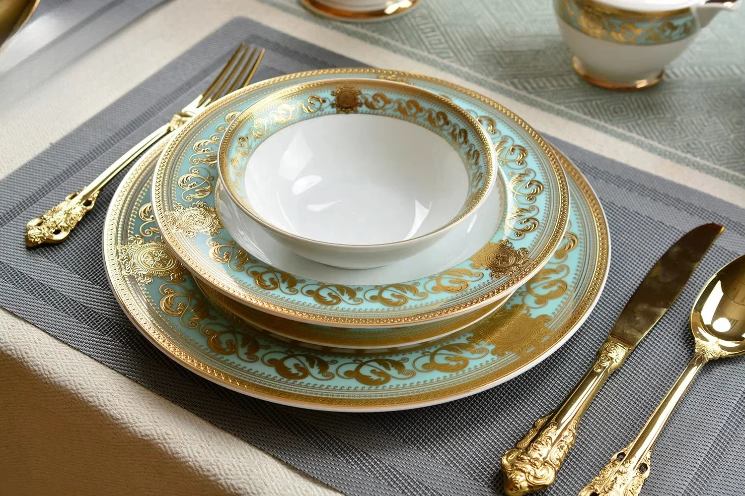 Elegant embossed gold porcelain dinnerware set by MC THE BLACK DIAMOND, featuring luxurious bone china with intricate gold detailing.