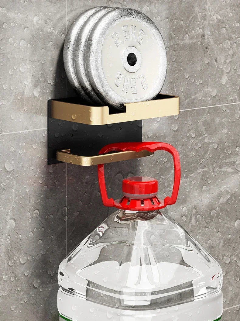 Black gold MC THE BLACK DIAMOND toilet paper holder mounted on bathroom wall with sleek modern design.