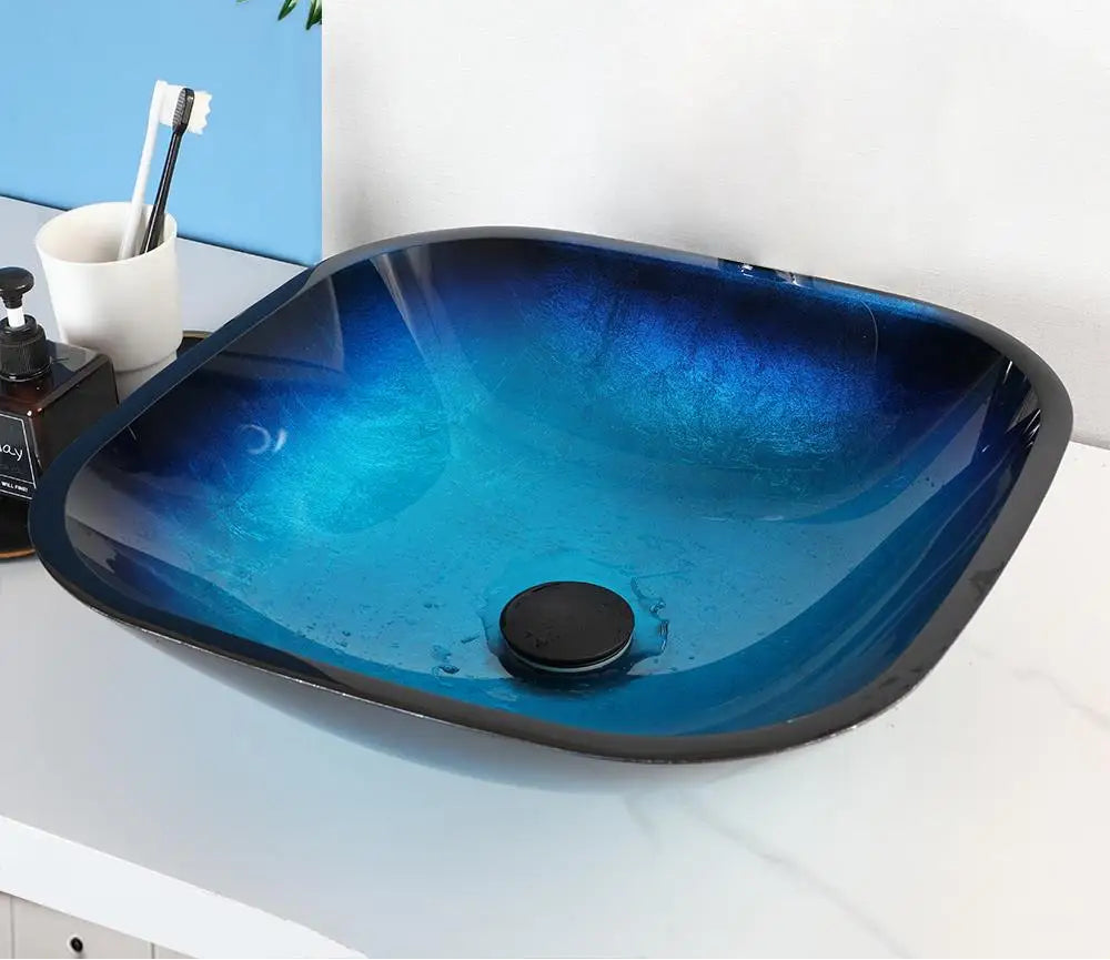MC THE BLACK DIAMOND ZAPPO tempered glass bathroom vessel sink with black waterfall faucet, oval blue basin, above counter design