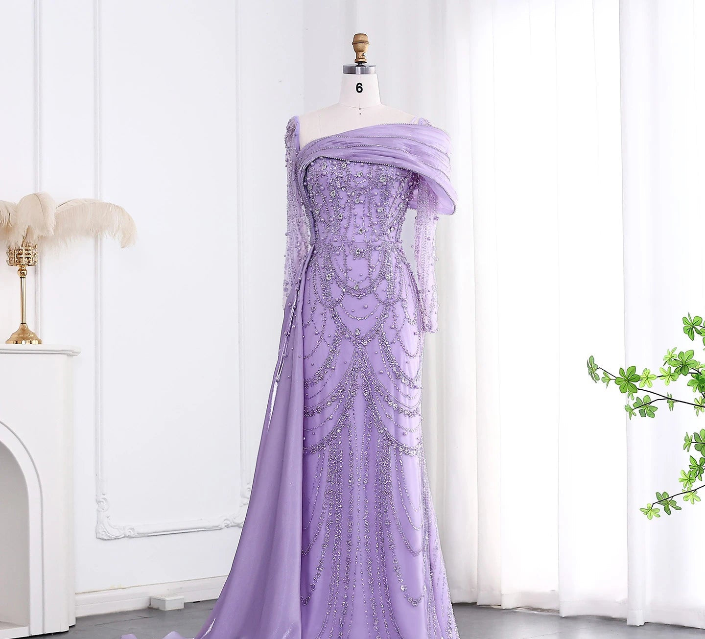 Elegant one-shoulder evening dress in luxurious tulle by MC THE BLACK DIAMOND featuring a flowing silhouette and sophisticated design.