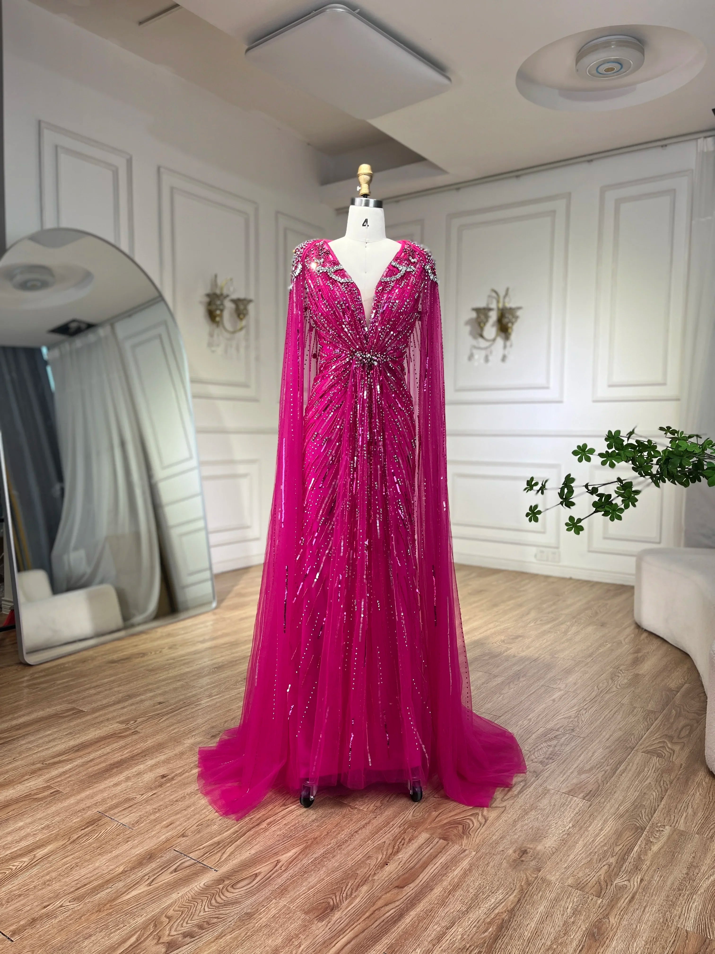 Turquoise mermaid evening dress by MC THE BLACK DIAMOND, featuring a fitted silhouette and elegant design for formal occasions.