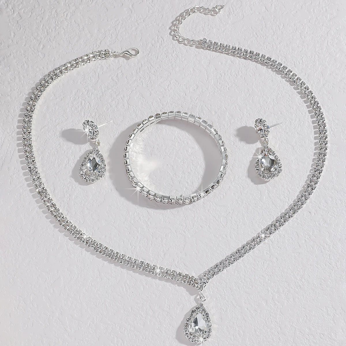 MC THE BLACK DIAMOND wedding season jewelry set with copper claw chain water drop necklace, earrings, and bracelet.