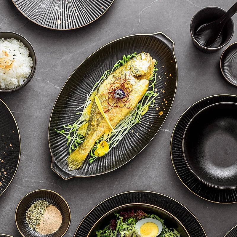 Set of black porcelain dinner plates with gilt rims, featuring food like salads, rice, and noodles, from ๐๐ ๐๐๐ ๐น๐๐๐๐ ๐ป๏ฟฝ