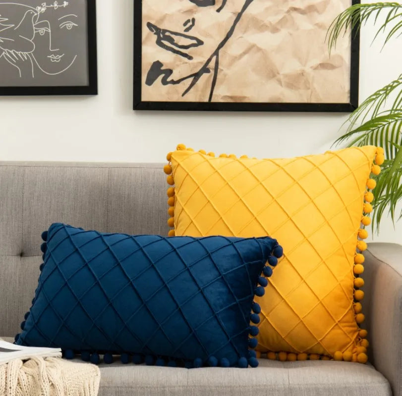 Yellow-orange velvet lumbar pillow cover with diamond stripes, pompom tassels, and available in 30x50cm and 45x45cm sizes.