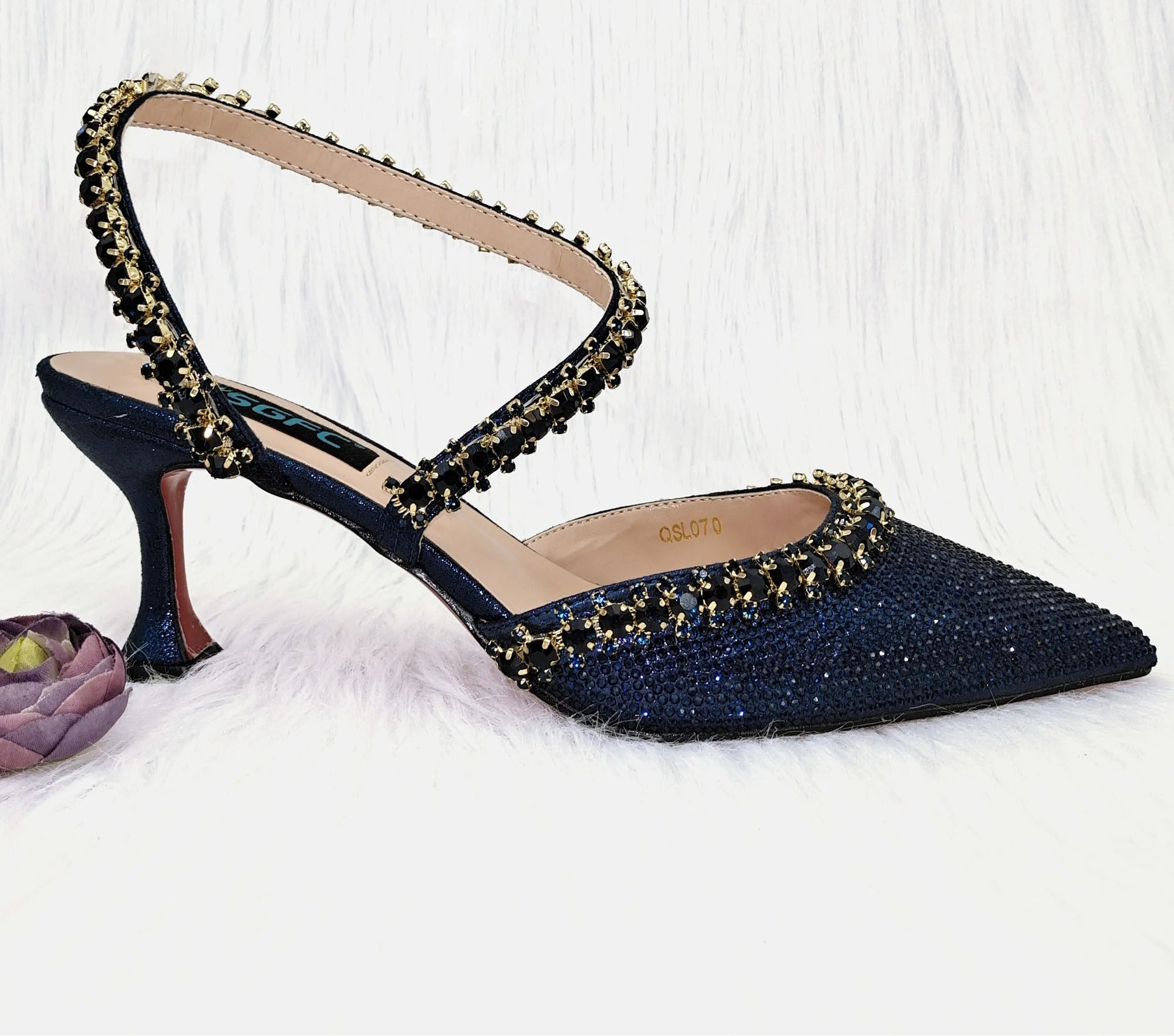 Royal blue MC THE BLACK DIAMOND high heels and metallic bucket bag with drill chain decoration, perfect for fashion events.