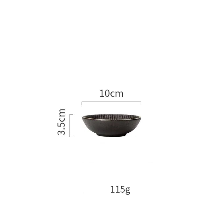 Luxury golden and black dinnerware set by MC THE BLACK DIAMOND, elegant tableware with gold accents and sleek black finish.