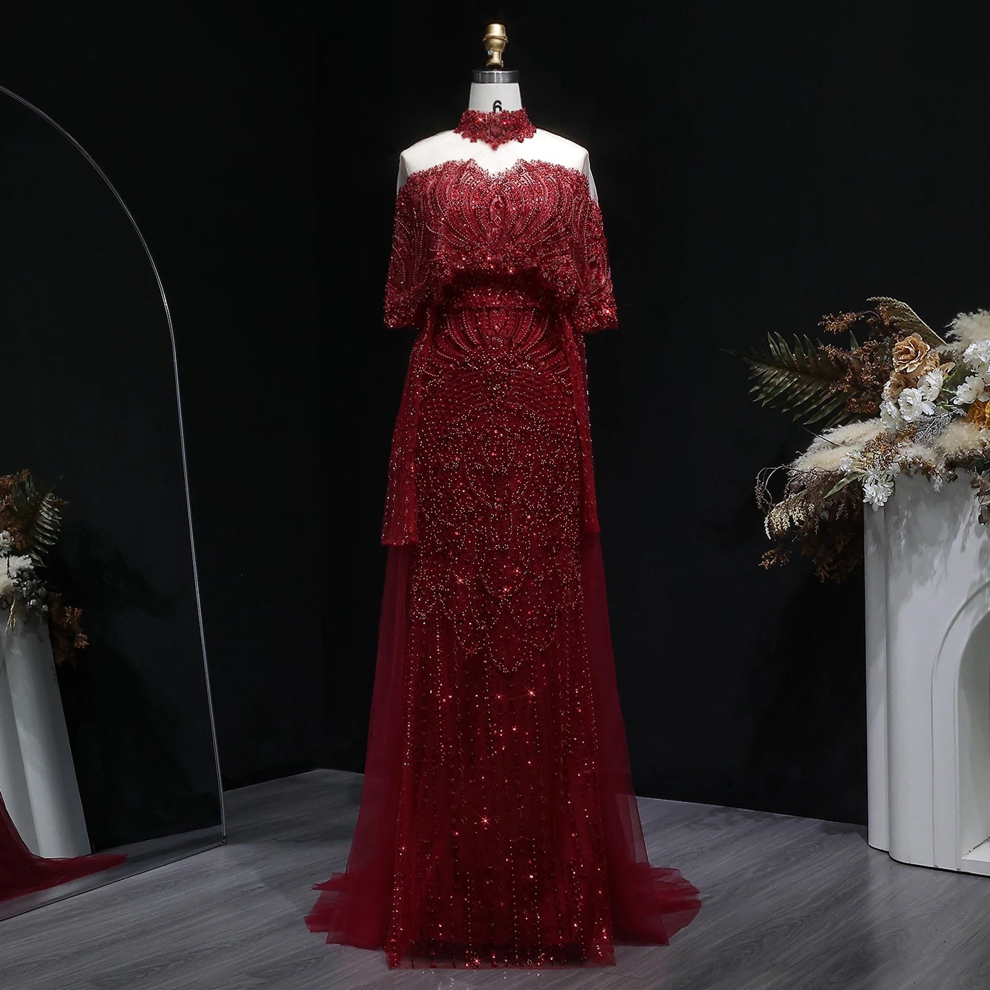 Beaded grey Arabic evening dress by MC THE BLACK DIAMOND featuring intricate beadwork and elegant design.