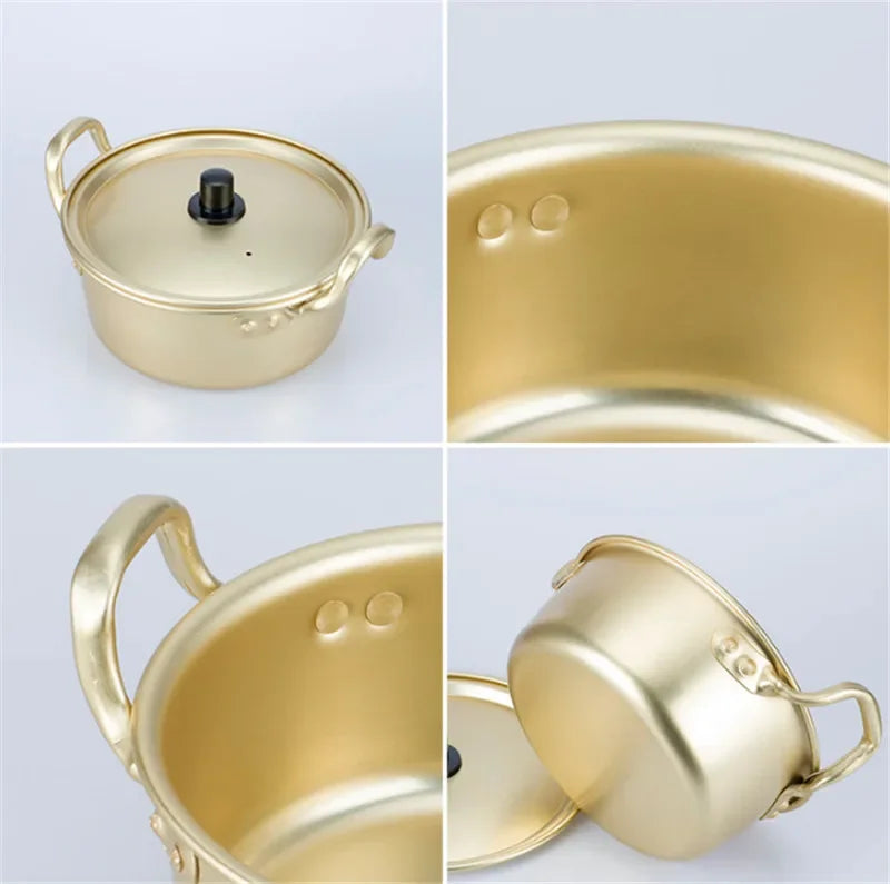 Korean style ramen noodles in a gold aluminum hot pot with egg soup cooking, featuring oxidized coating and black handle by MC THE BLACK DIAMOND