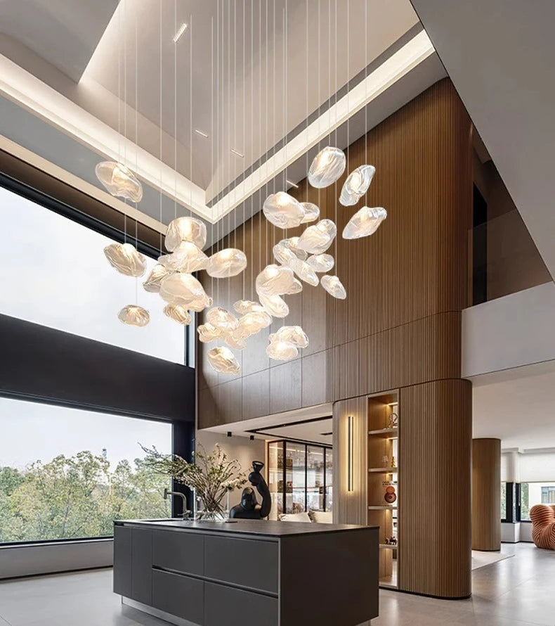 Nordic-style MC THE BLACK DIAMOND pendant light hanging in a living room or bedroom decor, modern and stylish stair chandelier.