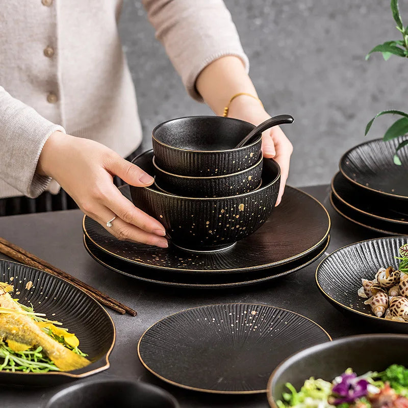Black porcelain dinner plate with gilt rim from ๐๐ ๐๐๐ ๐น๐๐๐๐ ๐ป๐๐๐๐ ๐