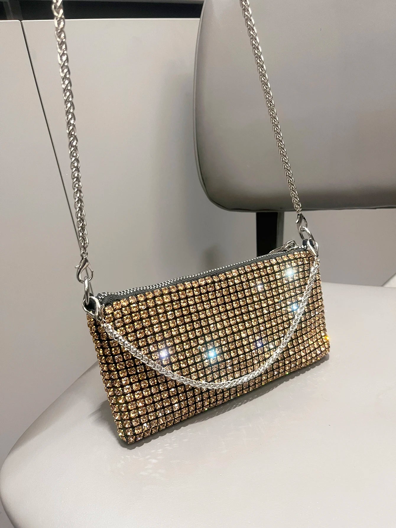 Luxury MC THE BLACK DIAMOND rhinestone clutch purse for women, elegant handle shoulder bag with sparkling embellishments.