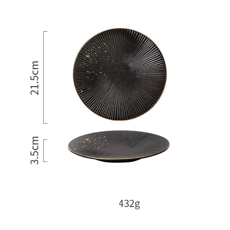 Luxury golden and black dinnerware set by MC THE BLACK DIAMOND, featuring elegant plates and bowls for sophisticated table settings.