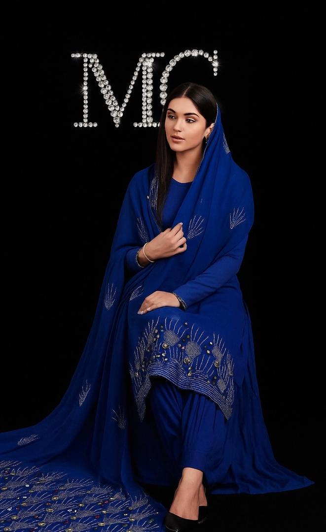 Blue rhinestone chiffon fabric by Mohammad Collection, 60-inch wide wedding drapes or dressmaking material with shimmering embellishments.