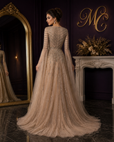 Elegant black MC THE BLACK DIAMOND evening dress with Arabic-inspired caramel beading and A-line silhouette for formal occasions.
