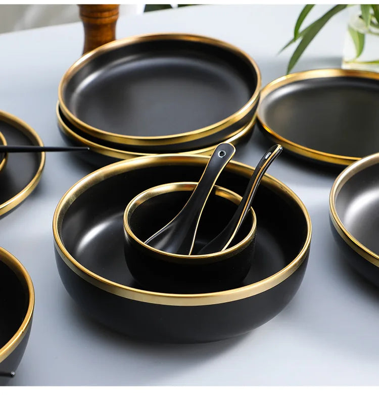 Set of black porcelain dinner plates with matte gold inlay from MC THE BLACK DIAMOND, elegant kitchen dinnerware collection.