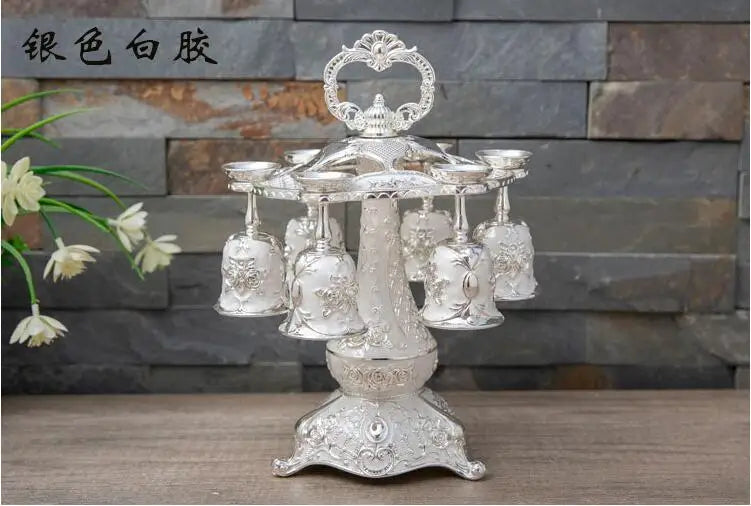 Set of six Europe metal decorative whiskey cups in gold and silver, ideal for kitchen or bar display.