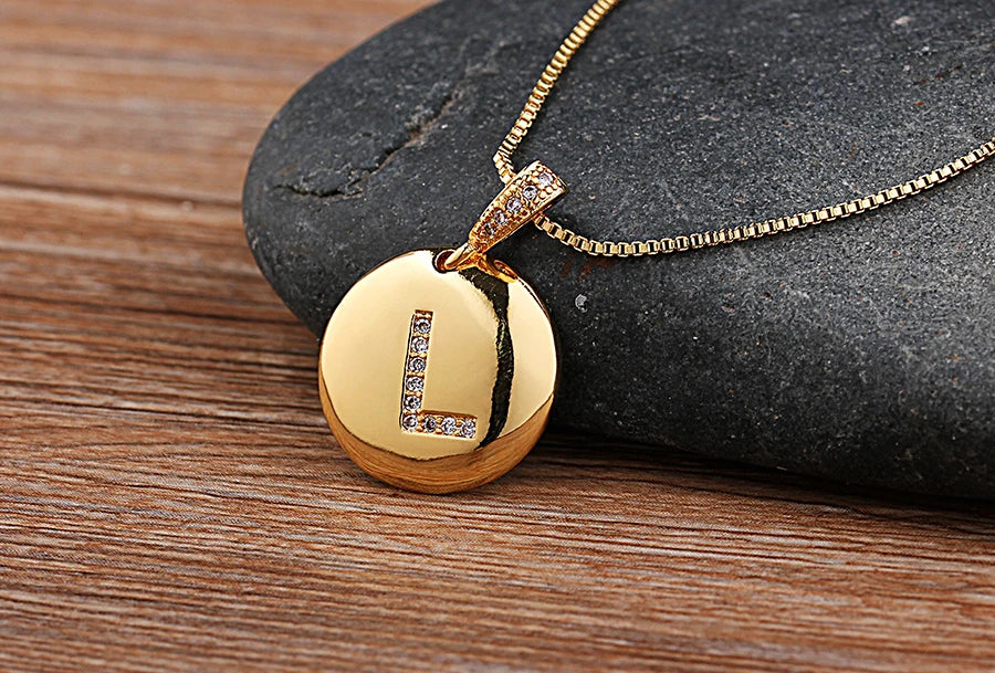 Close-up of Nidin initial letter necklace from 𝕄𝕮 𝕋𝕙𝕖 𝔹𝕝𝕒𝕔𝕜 𝔻𝕚𝕒𝕞𝕠�