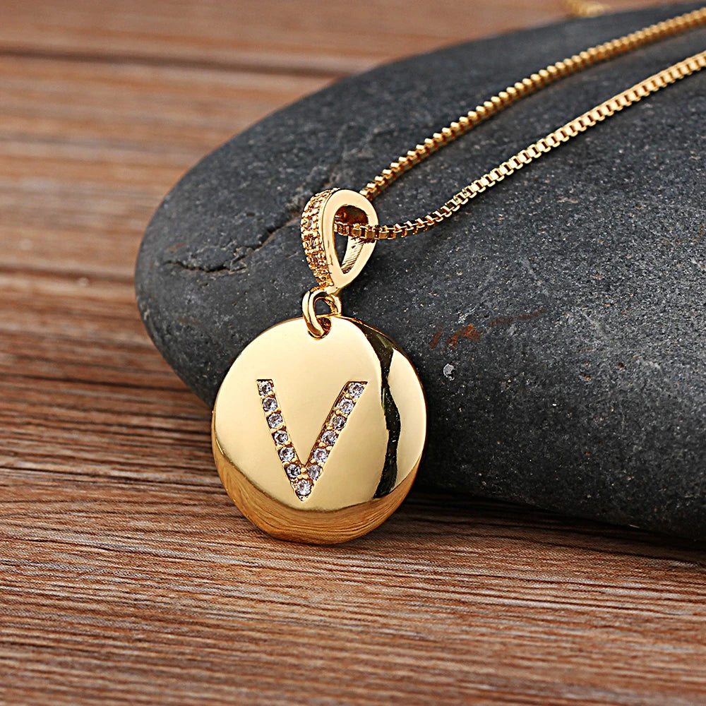 Nidin initial letter necklace featuring A-Z copper charm with CZ stones, jewelry by 𝕄𝕔 𝕋𝕙𝕖 𝔹𝕝𝕒𝕔𝕜 𝔻𝕚𝕒�