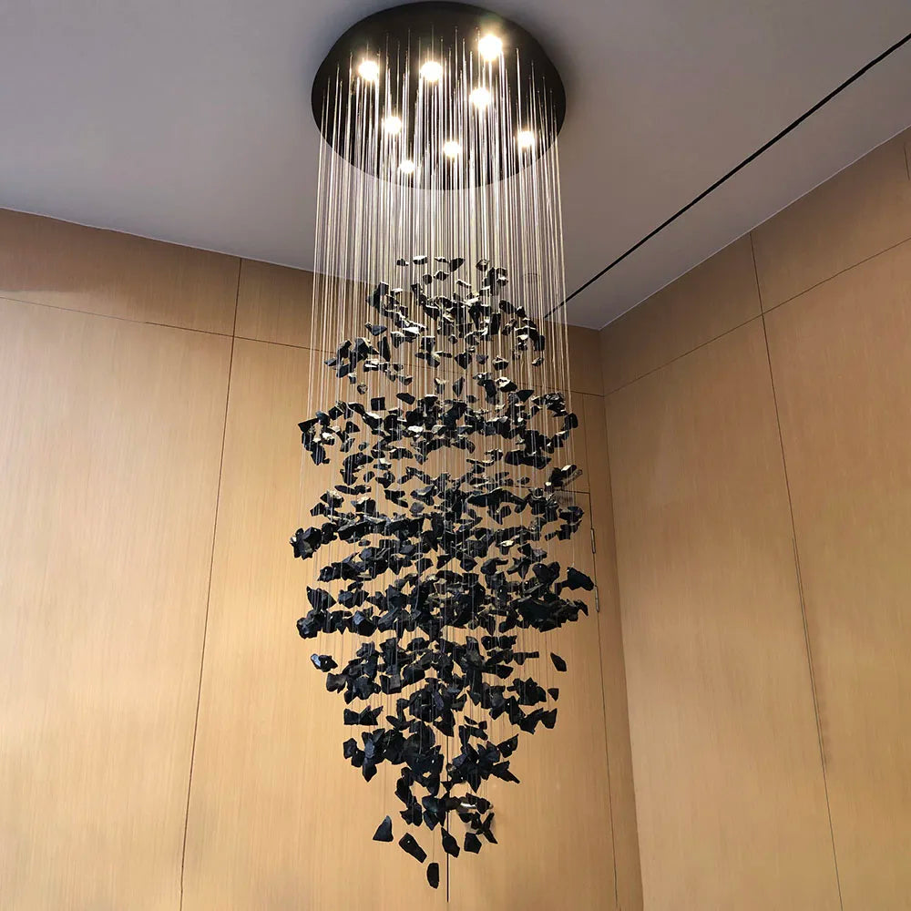 Modern stone crystal LED chandelier by MC THE BLACK DIAMOND, large luxury staircase and living room light fixture with elegant design.