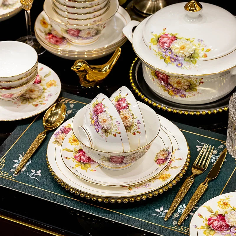 European style dinnerware set by MC The Black Diamonds, includes plates, bowls, and mugs arranged on a kitchen table.