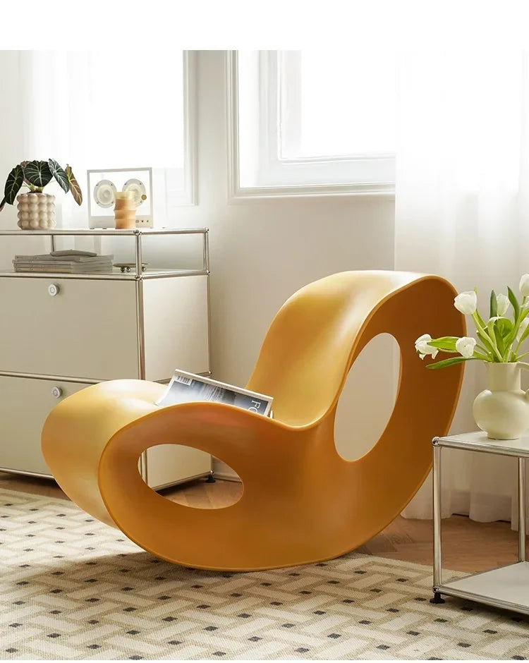 Modern MC THE BLACK DIAMOND rocking PE plastic lounge armchair with a sleek, curved design for contemporary home decor.