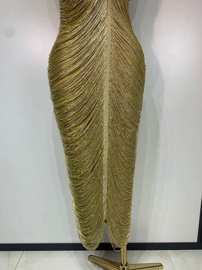 MC Women backless gold bandage bodycon dress with tassel details, stylish and form-fitting for elegant occasions.