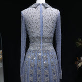 Elegant MC THE BLACK DIAMOND MC long sleeve evening dress with V-neck, beaded embellishments, A-line silhouette, perfect for prom or formal events.