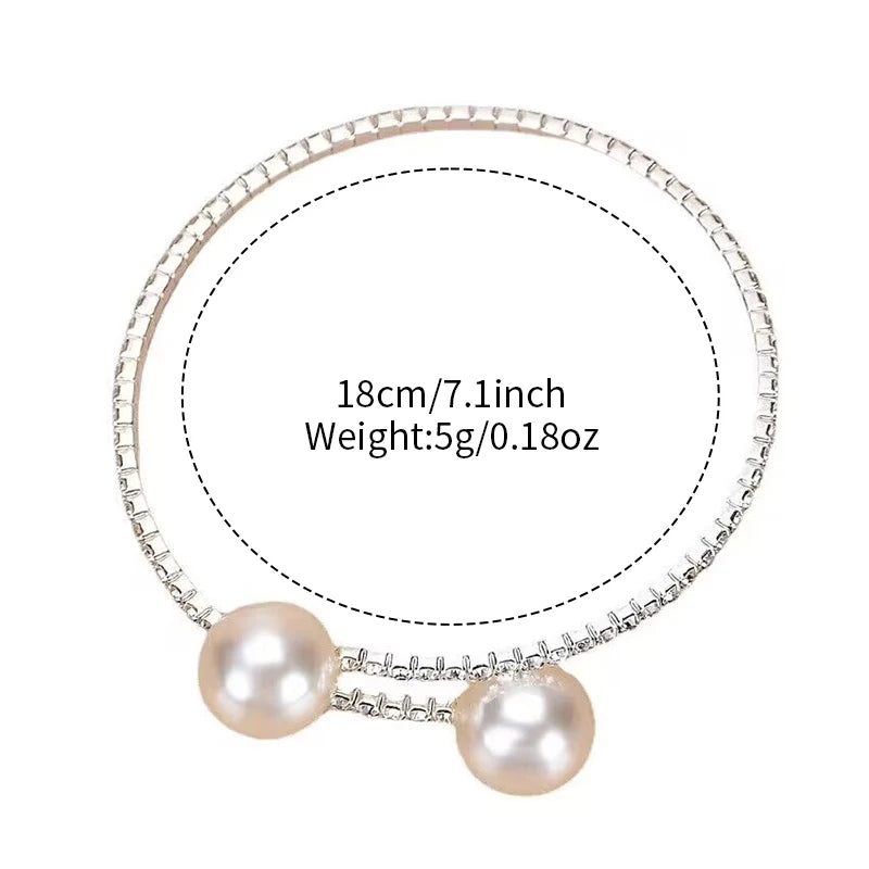 Two-piece women's watch and pearl diamond bracelet set by MC The Black Diamonds, featuring elegant watches with pearl and diamond accents.