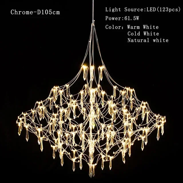 Modern chrome-plated luxury crystal chandelier by MC THE BLACK DIAMOND, featuring multiple hanging crystal prisms in a stylish living room setting.
