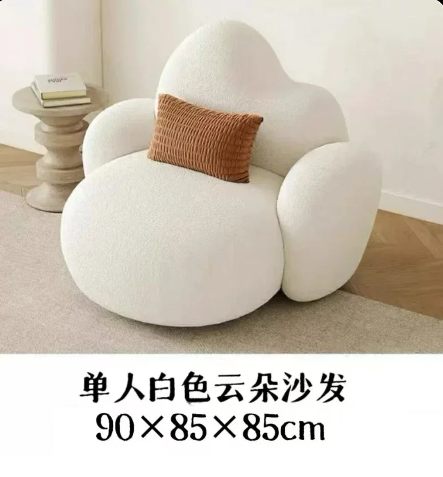 White MC THE BLACK DIAMOND sofa in a modern living room, featuring plush cushions and a comfortable lounge design.