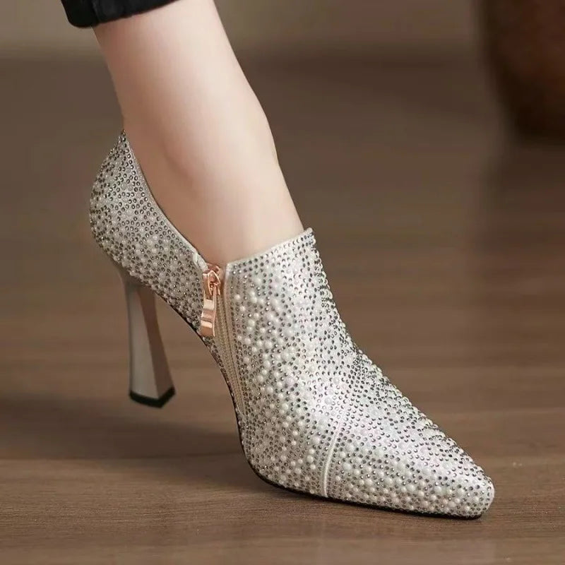 Luxury rhinestone high heels by Mohamad Collection featuring pointed toe, pearl accents, crystal embellishments, and a champagne finish.