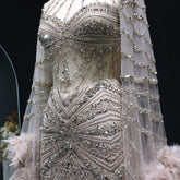 MC THE BLACK DIAMOND caramel beaded mermaid evening dress with feather cape sleeves for formal weddings and parties.
