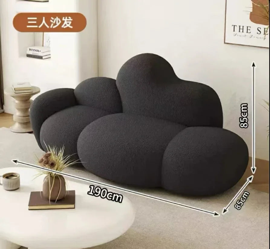 White MC THE BLACK DIAMOND sofa in a living room setting, showcasing a comfortable, relaxing lounge with plush cushions.